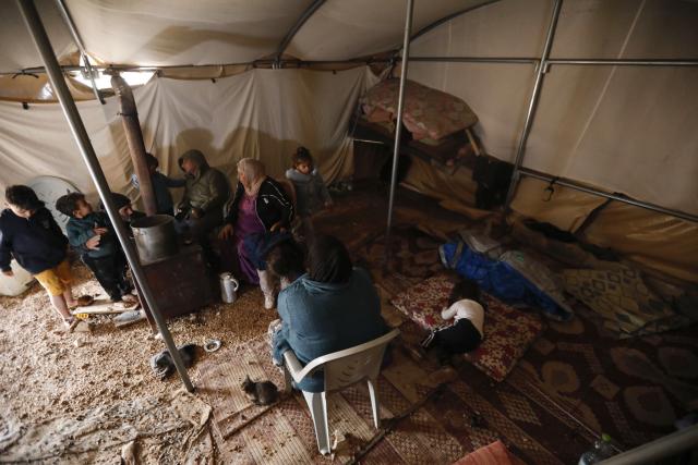 (251229) -- HEBRON, Dec. 29, 2025 (Xinhua) -- Members of a Palestinian family stay inside a tent in the Khallat al-Fara area, west of Yatta, south of the West Bank city of Hebron, Dec. 29, 2025. (Photo by Mamoun Wazwaz/Xinhua)