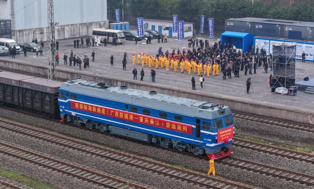 (251230) -- BEIJING, Dec. 30, 2025 (Xinhua) -- An aerial drone photo taken on Dec. 29, 2025 shows the first freight train from Fangchenggang City of Guangxi to Qijiang District of Chongqing arriving at the Qijiang North Railway Station in southwest China's Chongqing Municipality. (Xinhua/Chen Cheng)