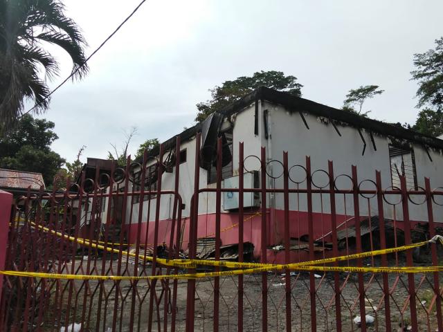 (251230) -- MANADO, Dec. 30, 2025 (Xinhua) -- This photo taken with a mobile phone shows a view of a nursing home after a fire, in Manado, the capital of North Sulawesi province, Indonesia, Dec. 29, 2025.
  Indonesian police are conducting identification procedures for 16 people killed in a fire that broke out at a nursing home in Manado, the capital of North Sulawesi province, local authorities said on Monday. (Photo by Swingly Manderes/Xinhua)