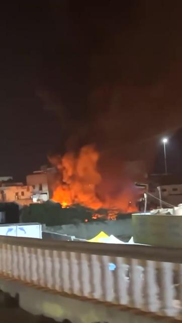 (251230) -- HADRAMOUT, Dec. 30, 2025 (Xinhua) -- This video snapshot captured on Dec. 30, 2025 shows the fire caused by airstrikes in Mukalla Port, Hadramout, Yemen. Saudi warplanes carried out airstrikes on Tuesday morning targeting the port of Mukalla in Yemen's southeastern oil-rich province of Hadramout, a local security official told Xinhua. (Xinhua)