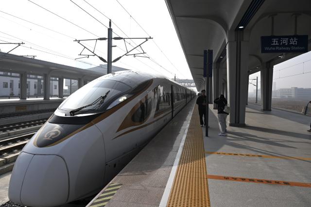 (251230) -- HEFEI, Dec. 30, 2025 (Xinhua) -- G9500, the first train of a newly-opened section of the Hefei-Xinyi high-speed railway, parks at the Wuhe Railway Station in Bengbu, east China's Anhui Province, Dec. 30, 2025.
  The Hefei-Sixian section of the Hefei-Xinyi high-speed railway was officially put into operation on Tuesday, marking the opening of another fast passenger line between Hefei City and eastern Anhui Province.
  The Hefei-Xinyi high-speed railway starts from Hefei West Railway Station in Hefei, and terminates at Xinyi East Railway Station in Xinyi City of Jiangsu Province. Spanning approximately 335 kilometers and with a design speed of 350 kilometers per hour, the railway is being constructed in phases. 
  The newly-opened section of the railway stretches 198 kilometers, setting five newly-built stations, namely Hefei West, Dingyuan East, Mingguang West, Wuhe, and Sixian East railway stations. (Xinhua/Huang Bohan)