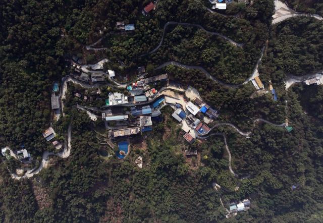 (251230) -- NANNING, Dec. 30, 2025 (Xinhua) -- An aerial drone photo taken on Dec. 29, 2025 shows a hamlet at Dongchun Village of Dafeng Town in Shanglin County, south China's Guangxi Zhuang Autonomous Region.
  Recent years saw local authorities in Guangxi boosting the development of tourism in the rural areas through a variety of cultural initiatives. (Xinhua/Huang Xiaobang)