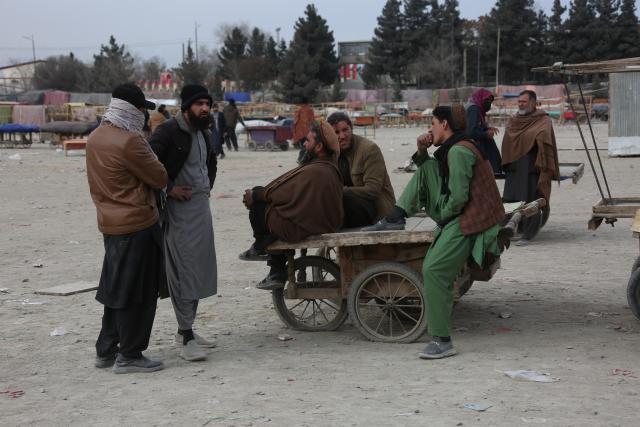 (251230) --  KABUL, Dec. 30, 2025 (Xinhua) -- Unemployed people wait for employers in Kabul, Afghanistan, Dec. 29, 2025. TO GO WITH "Feature: Workforce finds hope amid rising hardships in Kabul, Afghanistan" (Photo by Saifurahman Safi/Xinhua)