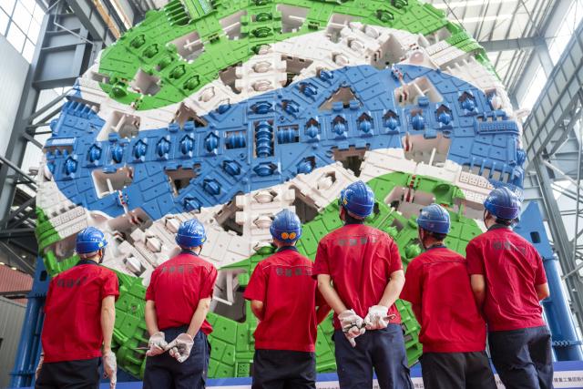 (251230) -- BEIJING, Dec. 30, 2025 (Xinhua) -- The "Qiangji" tunnel boring machine (TBM) rolls off the production line in Changsha, central China's Hunan Province, March 26, 2025. (Xinhua/Chen Sihan)