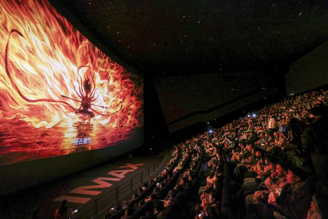 (251230) -- BEIJING, Dec. 30, 2025 (Xinhua) -- Audience watch the animated film "Ne Zha 2" at a cinema in Guiyang, southwest China's Guizhou Province, Feb. 25, 2025. (Xinhua/Ou Dongqu)