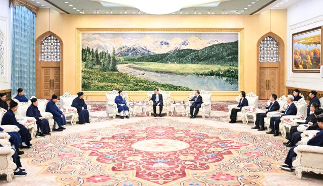 (251230) -- BEIJING, Dec. 30, 2025 (Xinhua) -- Wang Huning, a member of the Standing Committee of the Political Bureau of the Communist Party of China (CPC) Central Committee and chairman of the Chinese People's Political Consultative Conference (CPPCC) National Committee, meets with delegates attending the 11th national congress of the Taoist Association of China in Beijing, capital of China. The 11th national congress of the Taoist Association of China was held on Monday and Tuesday in Beijing. (Xinhua/Li Xiang)