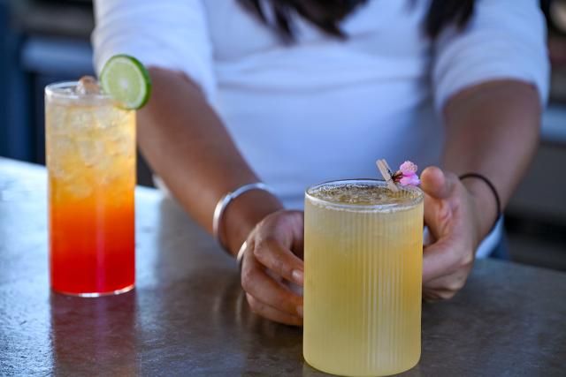 (251231) -- JINGHONG, Dec. 31, 2025 (Xinhua) -- This photo shows a new tea drinks designed by Wei Chun at a studio in Dadugang Township of Jinghong City, Xishuangbanna Dai Autonomous Prefecture, southwest China's Yunnan Province, Dec. 20, 2025. Wei Chun used to work at an international hotel in a first-tier city. In June 2024, she became an agricultural manager of a collective economy company in Dadugang Township, a role locals refer to as the "Village CEO." 
   Under her leadership, idle factory buildings and vacant land were transformed into cafes, educational spaces, and campsites, providing recreational spaces for visitors. Wei also offered free training in coffee making, tea art, and rural hospitality management, improving service quality and expanding employment opportunities for villagers.
   By 2025, Wei has helped more than 100 villagers acquire new skills and attracted nine talents returning home to start businesses here. (Xinhua/Chen Shuo)