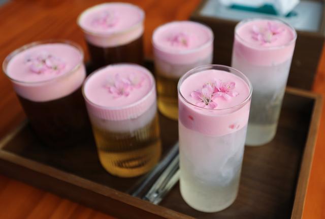 (251231) -- JINGHONG, Dec. 31, 2025 (Xinhua) -- This photo shows tea drinks and coffee made by villagers at a studio in Dadugang Township of Jinghong City, Xishuangbanna Dai Autonomous Prefecture, southwest China's Yunnan Province, Dec. 20, 2025. Wei Chun used to work at an international hotel in a first-tier city. In June 2024, she became an agricultural manager of a collective economy company in Dadugang Township, a role locals refer to as the "Village CEO." 
   Under her leadership, idle factory buildings and vacant land were transformed into cafes, educational spaces, and campsites, providing recreational spaces for visitors. Wei also offered free training in coffee making, tea art, and rural hospitality management, improving service quality and expanding employment opportunities for villagers.
   By 2025, Wei has helped more than 100 villagers acquire new skills and attracted nine talents returning home to start businesses here. (Xinhua/Du Xiaoyi)