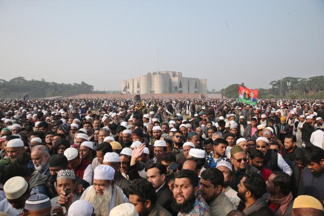 (251231) -- DHAKA, Dec. 31, 2025 (Xinhua) -- Mourners attend the funeral ceremony of former Bangladeshi Prime Minister Khaleda Zia at the Parliament house premises in Dhaka, Bangladesh on Dec. 31, 2025. Former Bangladeshi Prime Minister and Chairperson of the Bangladesh Nationalist Party (BNP) Khaleda Zia passed away due to illness at the age of 80 in the capital Dhaka at around 6 a.m. Tuesday local time. (Photo by Habibur Rahman/Xinhua)