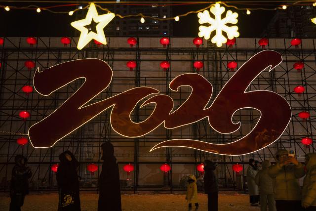 (260101) -- HARBIN, Jan. 1, 2026 (Xinhua) -- People have fun at the Heilongjiang Radio and TV Tower square in Harbin, northeast China's Heilongjiang Province, Dec. 31, 2025.
  Many scenic spots in the "Ice City" Harbin was illuminated Wednesday night, drawing tourists to celebrate the New Year. (Xinhua/Zhang Tao)