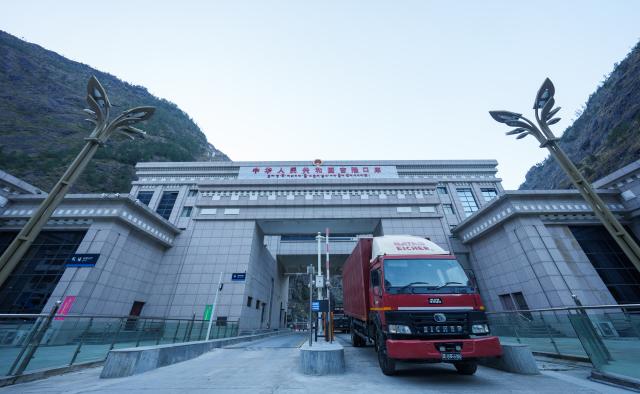 (260101) -- BEIJING, Jan. 1, 2026 (Xinhua) -- A truck from Nepal goes through the Gyirong Port after inspection in southwest China's Xizang Autonomous Region, Jan. 1, 2026. China-Nepal Gyirong-Rasuwa Port, one of the largest land ports between the two countries, resumed customs and passenger clearance on Thursday morning, nearly six months after the area was struck by flood. (Xinhua/Tenzin Nyida)