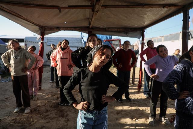 (260101) -- GAZA, Jan. 1, 2026 (Xinhua) -- Palestinian girls take part in a boxing training session aimed for psychological relief and physical empowerment at a displacement camp in the Al-Mawasi area of Khan Younis, southern Gaza Strip, on Dec. 31, 2025. (Photo by Rizek Abdeljawad/Xinhua)