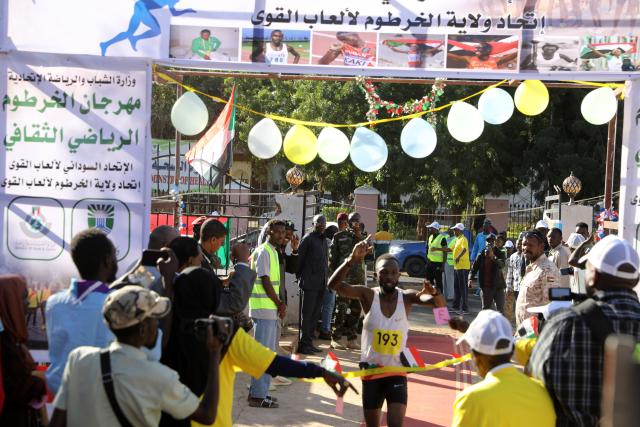(260101) -- KHARTOUM, Jan. 1, 2026 (Xinhua) -- An athlete competes in a running match during Khartoum Youth Sports Festival in Khartoum, Sudan, Jan. 1, 2026. Khartoum on Thursday launched the Khartoum Youth Sports Festival under the slogan "Together We Make Life," marking Sudan's 70th independence anniversary and offering a rare glimpse of public life nearly three years into the country's civil war. (Photo by Mohamed Khidir/Xinhua)
