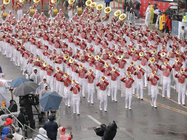 (260102) -- PASADENA, Jan. 2, 2026 (Xinhua) -- Performers march during the 137th Rose Parade in Pasadena, California, the United States, on Jan. 1, 2026. The 137th Rose Parade kicked off Thursday morning in Pasadena, known as the "City of Roses." It was the first time in two decades that the parade was held in rainy conditions, as a powerful winter storm drenched the region.
   Themed "The Magic in Teamwork," this year's parade featured dozens of flower-decorated floats, equestrian units and marching bands from across the United States and around the world along the 5.5-mile route. (Photo by Qiu Chen/Xinhua)