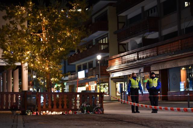 (260102) -- CRANS-MONTANA, Jan. 2, 2026 (Xinhua) -- Candles and flowers to mourn the victims of a fire at a bar in the Crans-Montana ski resort are pictured in Valais Canton of southwestern Switzerland, Jan. 1, 2026. Around 40 people were killed and more than 110 others injured after a fire broke out at a bar in the Crans-Montana ski resort in Valais Canton in southwestern Switzerland, local police said on Thursday. (Xinhua/Lian Yi)