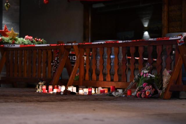 (260102) -- CRANS-MONTANA, Jan. 2, 2026 (Xinhua) -- Candles and flowers to mourn the victims of a fire at a bar in the Crans-Montana ski resort are pictured in Valais Canton of southwestern Switzerland, Jan. 1, 2026. Around 40 people were killed and more than 110 others injured after a fire broke out at a bar in the Crans-Montana ski resort in Valais Canton in southwestern Switzerland, local police said on Thursday. (Xinhua/Lian Yi)