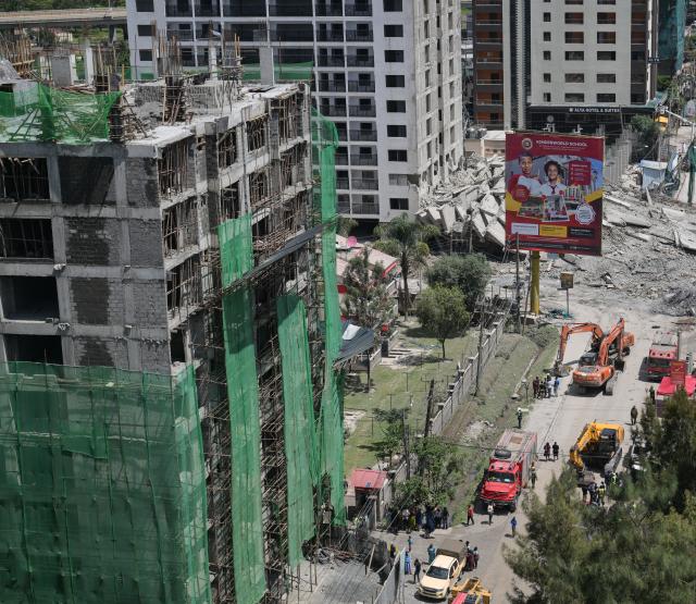 (260102) -- NAIROBI, Jan. 2, 2026 (Xinhua) -- This photo taken on Jan. 2, 2026 shows a collapsed building (rear) in Nairobi, the capital of Kenya. At least one person was injured and two others are missing after a 16-storey building under construction collapsed early Friday in Nairobi, Kenya's capital, police and a charity organization said. (Xinhua/Yang Guang)