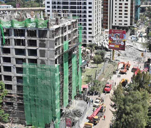 (260102) -- NAIROBI, Jan. 2, 2026 (Xinhua) -- This photo taken on Jan. 2, 2026 shows a collapsed building (rear) in Nairobi, the capital of Kenya. At least one person was injured and two others are missing after a 16-storey building under construction collapsed early Friday in Nairobi, Kenya's capital, police and a charity organization said. (Xinhua/Liu Qiong)