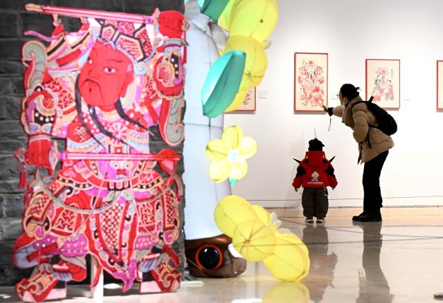 (260102) -- BEIJING, Jan. 2, 2026 (Xinhua) -- People visit an exhibition themed on nianhua, a type of centuries-old Chinese woodcut New Year picture, at the Shijiazhuang Art Museum in Shijiazhuang, north China's Hebei Province, Jan. 2, 2026. Diverse exhibitions staged at museums, galleries and other cultural institutions across the country have greatly enriched people's life during the New Year holiday. (Photo by Chen Qibao/Xinhua)