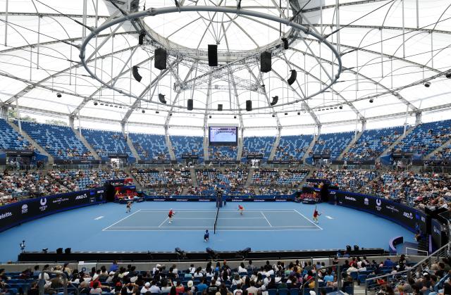 (260103) -- SYNDEY, Jan. 3, 2026 (Xinhua) -- Zhu Lin (2nd R)/Zhang Zhizhen (1st R) of China and Elise Mertens (1st L)/Zizou Bergs (2nd L) of Belgium compete during the mixed doubles match in the Group B round robin match between China and Belgium at the 2026 United Cup tennis tournament in Sydney, Australia, Jan. 3, 2026. (Xinhua/Ma Ping)