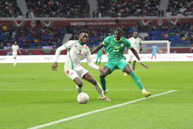 (260104) -- TANGIERS, Jan. 4, 2026 (Xinhua) -- Sudan's Mohamed Saeed Ahmed (L) contests the ball with Senegal's El Hadji Malick Diouf during round of 16 football match between Senegal and Sudan at the CAF Africa Cup of Nations 2025 in Tangiers, Morocco, Jan. 3, 2026. (Photo by Aissa/Xinhua)