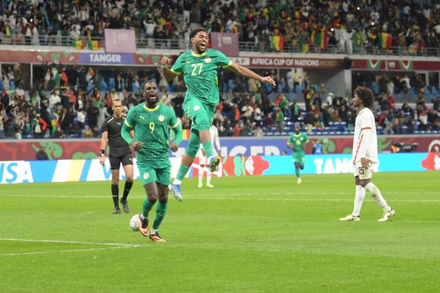 (260104) -- TANGIERS, Jan. 4, 2026 (Xinhua) -- Senegal's Ibrahim Mbaye (top) celebrates scoring his team's third goal during round of 16 football match between Senegal and Sudan at the CAF Africa Cup of Nations 2025 in Tangiers, Morocco, Jan. 3, 2026. (Photo by Aissa/Xinhua)
