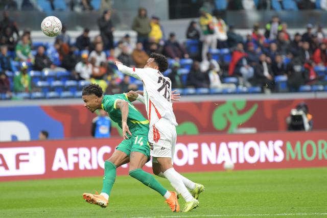 (260104) -- TANGIERS, Jan. 4, 2026 (Xinhua) -- Sudan's Aamir Yunis Abdallah (R) fights for the ball with Senegal's Ismail Jakobs during round of 16 football match between Senegal and Sudan at the CAF Africa Cup of Nations 2025 in Tangiers, Morocco, Jan. 3, 2026. (Photo by Aissa/Xinhua)