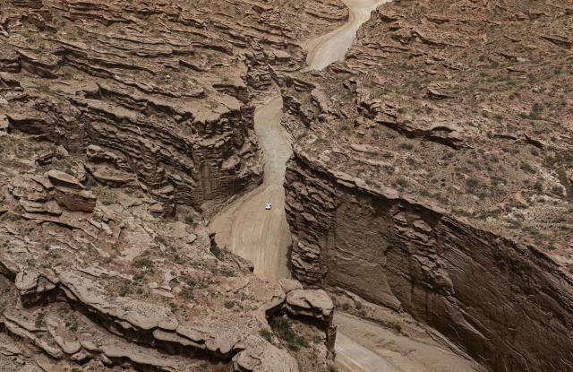 (260104) -- BEIJING, Jan. 4, 2025 (Xinhua) -- An aerial drone photo taken on May 21, 2025 shows a car racing during Stage 1 of the 2025 Taklimakan Rally in Wensu County, Aksu Prefecture, northwest China's Xinjiang Uygur Autonomous Region. (Xinhua/Hu Xingyu)