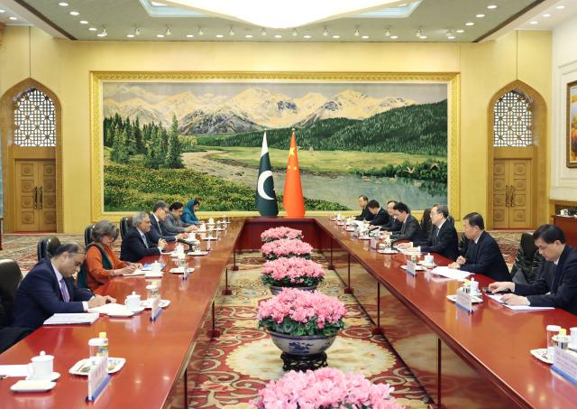 (260104) -- BEIJING, Jan. 4, 2026 (Xinhua) -- Chinese Vice Premier Ding Xuexiang, also a member of the Standing Committee of the Political Bureau of the Communist Party of China Central Committee, meets with Pakistani Deputy Prime Minister and Foreign Minister Mohammad Ishaq Dar in Beijing, capital of China, Jan. 4, 2026. (Xinhua/Liu Weibing)
