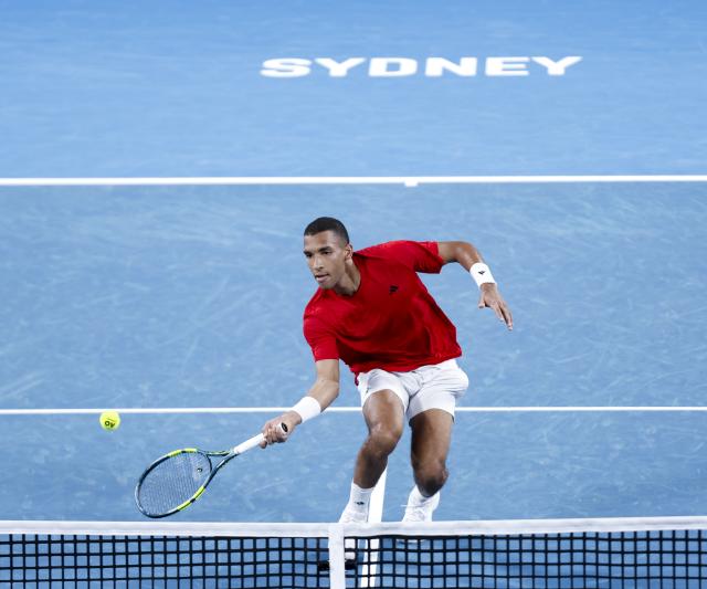 (260104) -- SYDNEY, Jan. 4, 2026 (Xinhua) -- Felix Auger-Aliassime of Canada hits a return against Zhang Zhizhen of China in the Group B round robin match between China and Canada at the 2026 United Cup tennis tournament in Sydney, Australia, Jan. 4, 2026. (Xinhua/Ma Ping)