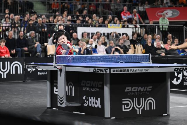 (260104) -- NEU-ULM, Jan. 4, 2026 (Xinhua) -- Fan Zhendong of 1. FC Saarbrucken Tischtennis hits a return in the men's singles match
against Togami Shunsuke of TTF Liebherr Ochsenhausen during the semifinal between 1. FC Saarbrucken Tischtennis and TTF Liebherr Ochsenhausen of Liebherr Pokal table tennis tournament in Neu-Ulm, Germany, Jan. 4, 2026. (Photo by Ulrich Hufnagel/Xinhua)