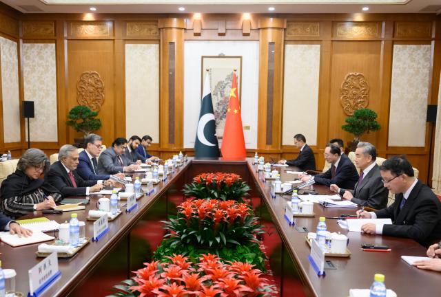 (260104) -- BEIJING, Jan. 4, 2026 (Xinhua) -- Chinese Foreign Minister Wang Yi, also a member of the Political Bureau of the Communist Party of China Central Committee, holds the Seventh Round of China-Pakistan Foreign Ministers' Strategic Dialogue with Pakistani Deputy Prime Minister and Foreign Minister Mohammad Ishaq Dar in Beijing, capital of China, Jan. 4, 2026. (Xinhua/Jin Liangkuai)