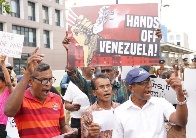 (260105) -- COLOMBO, Jan. 5, 2026 (Xinhua) -- People take part in a rally opposing U.S. attack on Venezuela outside the U.S. Embassy in Colombo, Sri Lanka, Jan. 5, 2026. (Xinhua/Wu Ziyu)