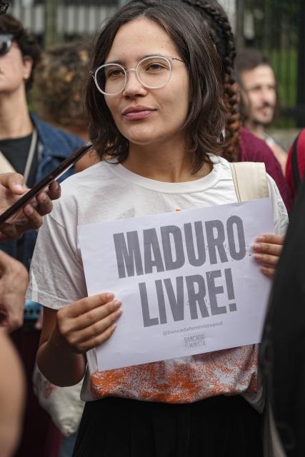 (260106) -- SAO PAULO, Jan. 6, 2026 (Xinhua) -- People take part in a protest against the U.S. military strike on Venezuela outside the U.S. Consulate General in Sao Paulo, Brazil, Jan. 5, 2026. (Photo by Paulo Lopes/Xinhua)