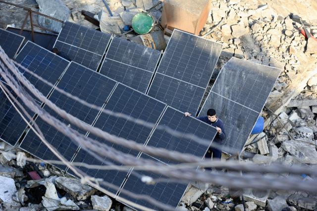 (260106) -- SIDON, Jan. 6, 2026 (Xinhua) -- A citizen searches for survivors in debris after an Israeli airstrike in Sidon, southern Lebanon, Jan. 6, 2026. The Israeli military announced on Monday that it struck Hezbollah and Hamas sites in Lebanon, citing "continued violations of the ceasefire understandings." (Photo by Ali Hashisho/Xinhua)