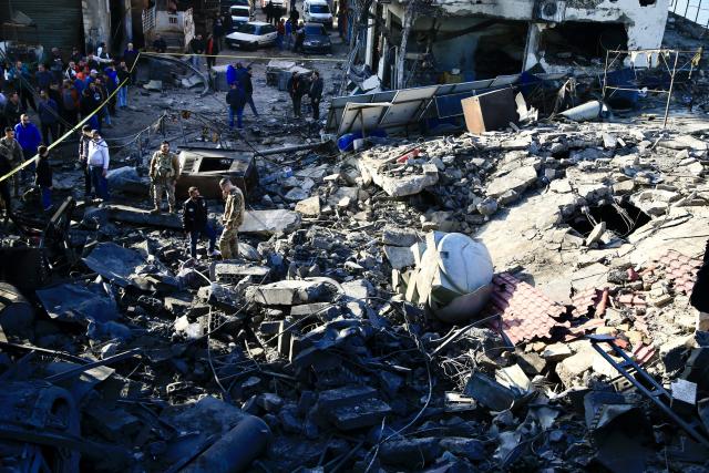 (260106) -- SIDON, Jan. 6, 2026 (Xinhua) -- Citizens and soldiers of the Lebanese Army search for survivors in debris after an Israeli airstrike in Sidon, southern Lebanon, Jan. 6, 2026. The Israeli military announced on Monday that it struck Hezbollah and Hamas sites in Lebanon, citing "continued violations of the ceasefire understandings." (Photo by Ali Hashisho/Xinhua)