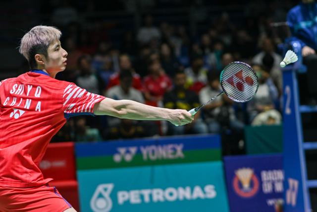 (260106) -- KUALA LUMPUR, Jan. 6, 2026 (Xinhua) -- Shi Yuqi of China hits a return during the men's singles round of 32 match against Rasmus Gemke of Denmark at the Malaysia Open 2026 badminton tournament in Kuala Lumpur, Malaysia, Jan. 6, 2026. (Photo by Chong Voon Chung/Xinhua)