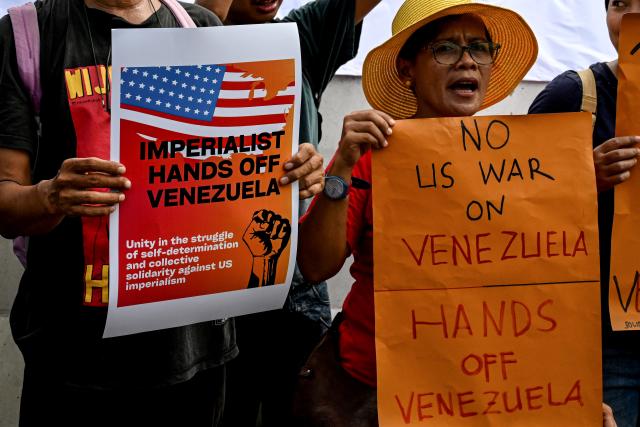 (260106) -- JAKARTA, Jan. 6, 2026 (Xinhua) -- People holding placards protest against the U.S. military strike against Venezuela, outside the U.S. Embassy in Jakarta, Indonesia, Jan. 6, 2026. (Photo by Agung Kuncahya B./Xinhua)