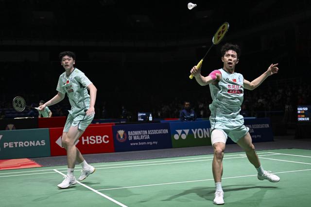 (260106) -- KUALA LUMPUR, Jan. 6, 2026 (Xinhua) -- Chen Boyang/Liu Yi (R) of China compete during the men's doubles round of 32 match against Kim Won Ho/Seo Seung Jae of South Korea at the Malaysia Open 2026 badminton tournament in Kuala Lumpur, Malaysia, Jan. 6, 2026. (Xinhua/Cheng Yiheng)