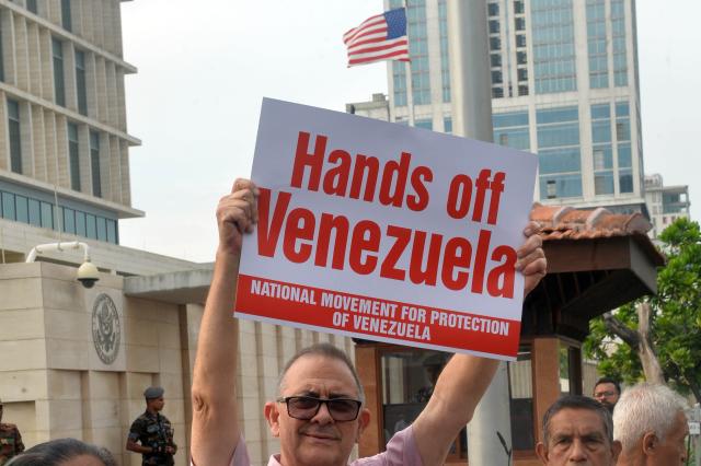 (260106) -- COLOMBO, Jan. 6, 2026 (Xinhua) -- People take part in a protest opposing U.S. attack on Venezuela in front of the U.S. embassy in Colombo, Sri Lanka, Jan. 6, 2026. (Photo by Gayan Sameera/Xinhua)