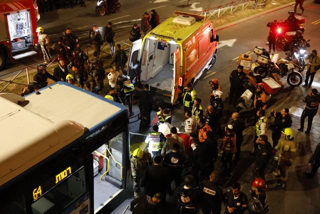 (260106) -- JERUSALEM, Jan. 6, 2026 (Xinhua) -- Israeli paramedics load the body of a teenage boy into an ambulance in Jerusalem, Jan. 6, 2026. A teenage boy was killed and three others were injured on Tuesday after a bus driver rammed into a protest by ultra-Orthodox Jews in Jerusalem, Israel's emergency services said. (Photo by Jamal Awad/Xinhua)
