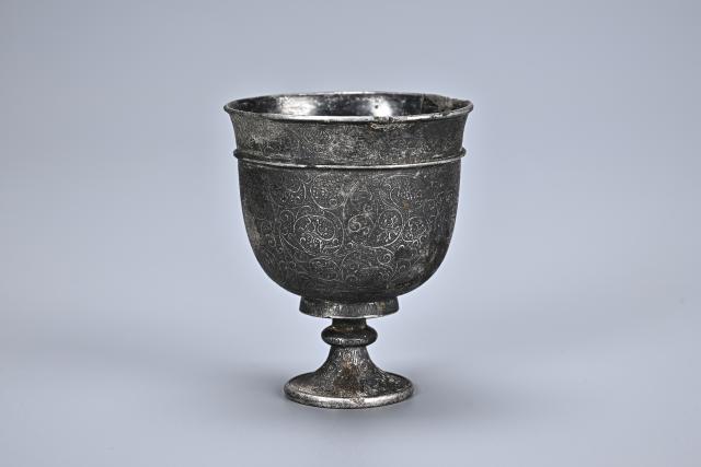 (260107) -- XI'AN, Jan. 7, 2026 (Xinhua) -- This undated file photo shows a silver stemmed cup unearthed from the tomb of Ma Sanniang, wife of Dong Shunxian, a military officer in the Tang Dynasty (618-907), in Xi'an, northwest China's Shaanxi Province. TO GO WITH "Tang Dynasty tomb with exquisite artifacts unearthed in Xi'an" (Shaanxi Academy of Archaeology/Handout via Xinhua)