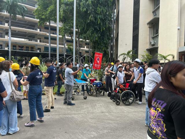 (260107) -- MANILA, Jan. 7, 2026 (Xinhua) -- People gather outside school buildings after a 6.7-magnitude earthquake in Davao Oriental province in the southern Philippines, Jan. 7, 2025. The Philippine Institute of Volcanology and Seismology said a magnitude 6.7 earthquake hit off Davao Oriental province in the southern Philippines on Wednesday morning. (Xinhua)