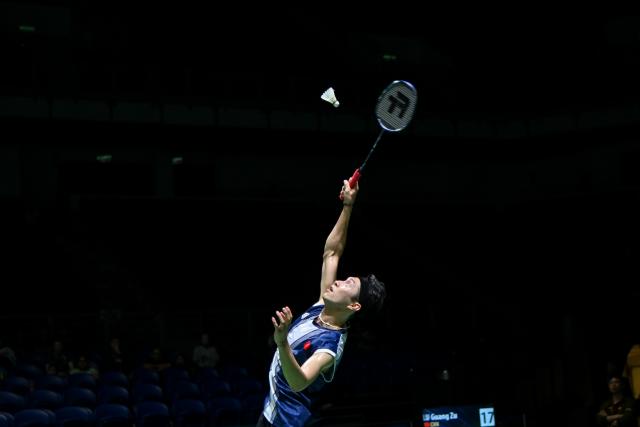 (260107) -- KUALA LUMPUR, Jan. 7, 2026 (Xinhua) -- Angus Ng Ka Long of China's Hong Kong hits a return during the men's singles round of 32 match against Lu Guangzu of China at the Malaysia Open 2026 badminton tournament in Kuala Lumpur, Malaysia, Jan. 7, 2026. (Photo by Chong Voon Chung/Xinhua)