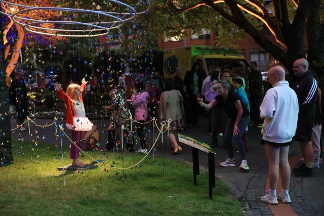 (260107) -- WELLINGTON, Jan. 7, 2026 (Xinhua) -- People have fun at the annual Gardens Magic concert at Wellington Botanic Garden in Wellington, New Zealand, Jan. 6, 2026. (Photo by Meng Tao/Xinhua)