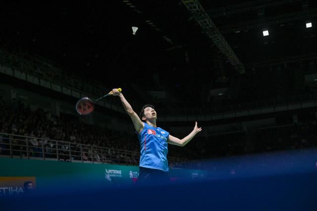 (260107) -- KUALA LUMPUR, Jan. 7, 2026 (Xinhua) - Watanabe Koki of Japan hits a return during the men's singles round of 32 match against Weng Hongyang of China at the Malaysia Open 2026 badminton tournament in Kuala Lumpur, Malaysia, Jan. 7, 2026. (Photo by Chong Voon Chung/Xinhua)
