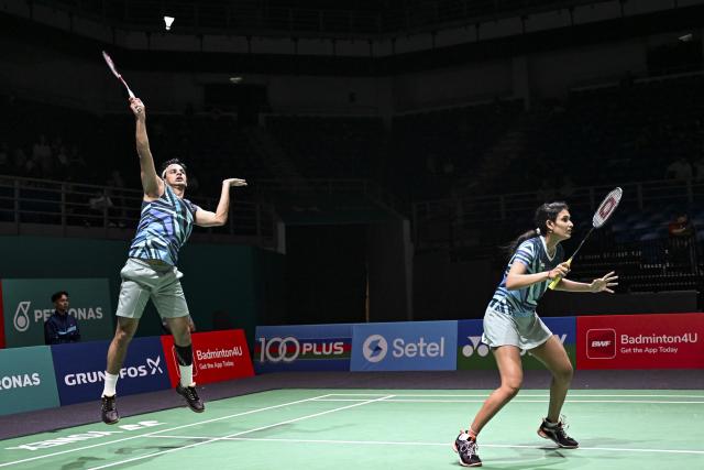 (260107) -- KUALA LUMPUR, Jan. 7, 2026 (Xinhua) -- Rohan Kapoor (L)/Ruthvika Shivani Gadde of India compete during the mixed doubles round of 32 match against Jiang Zhenbang/Wei Yaxin of China at the Malaysia Open 2026 badminton tournament in Kuala Lumpur, Malaysia, Jan. 7, 2026. (Xinhua/Cheng Yiheng)