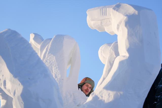 (260107) -- HARBIN, Jan. 7, 2026 (Xinhua) -- A contestant works on a snow sculpture at the compound for the Sun Island International Snow Sculpture Art Expo in Harbin, northeast China's Heilongjiang Province, Jan. 7, 2026. The 28th Harbin international snow sculpture competition kicked off here on Tuesday, attracting 25 teams of snow sculptors from 13 countries. Various snow sculpture works have begun to take shape on Wednesday. (Xinhua/Wang Jianwei)