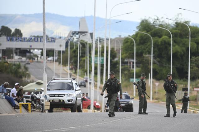 (260107) -- PACARAIMA, Jan. 7, 2026 (Xinhua) -- In this photo taken in Pacaraima, Roraima, Brazil, members of the Bolivarian National Guard of Venezuela patrol the border between Brazil and Venezuela on Jan. 6, 2026. (Photo by Lucio Tavora/Xinhua)