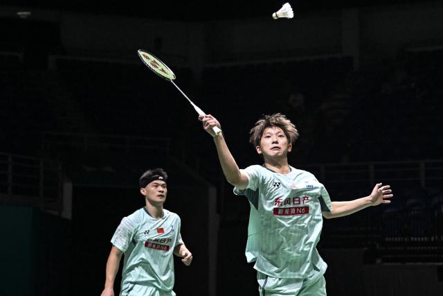 (260107) -- KUALA LUMPUR, Jan. 7, 2026 (Xinhua) -- Chen Xujun/Liu Yang (R) of China compete during the men's doubles round of 32 match against Liu Kuang Heng/Yang Po Han of Chinese Taipei at the Malaysia Open 2026 badminton tournament in Kuala Lumpur, Malaysia, Jan. 7, 2026. (Xinhua/Cheng Yiheng)